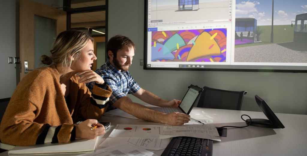 Art and Engineering students from the University of Iowa work on plans for the Plymouth, Iowa bus shelter