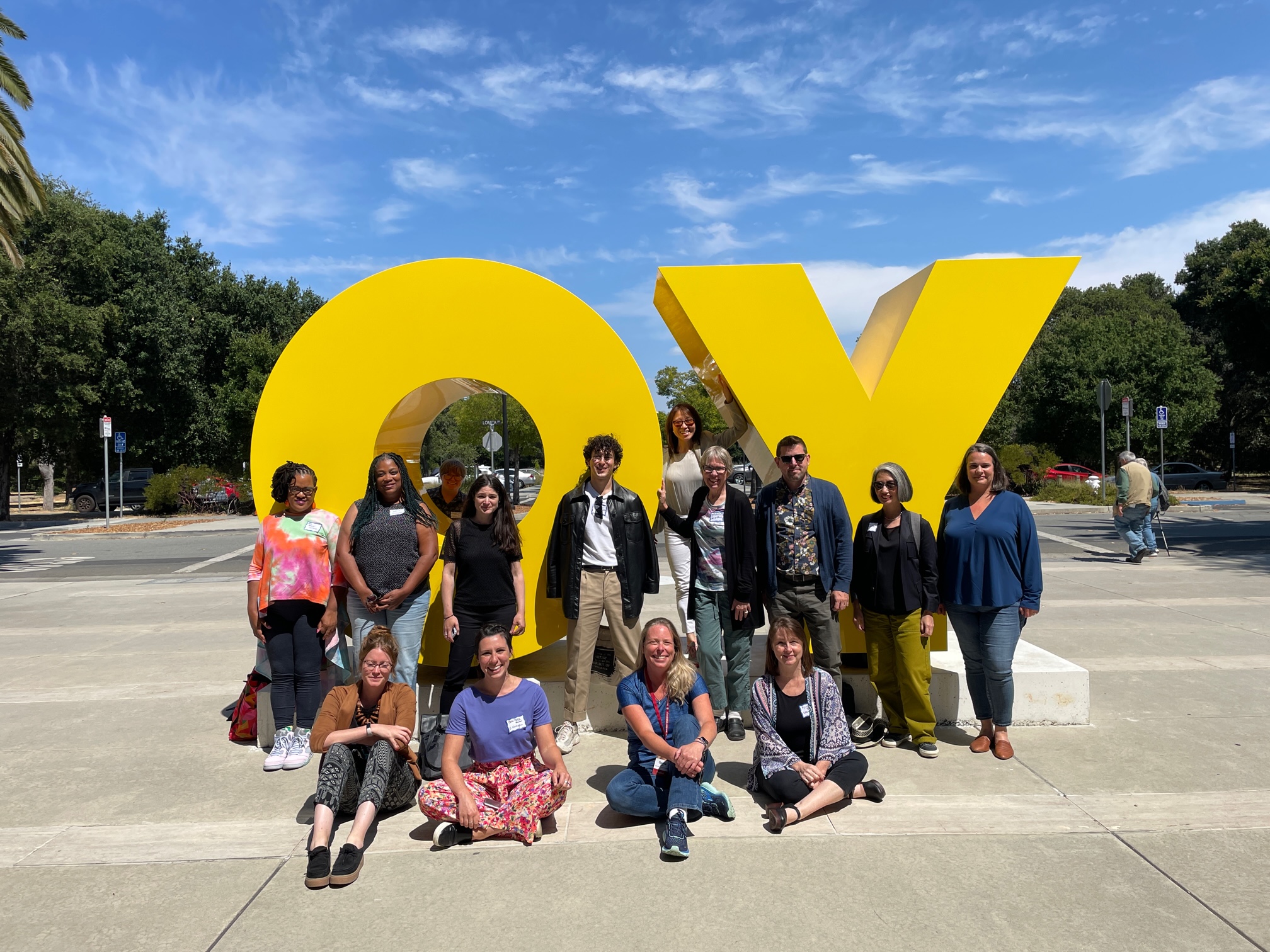 AAHE members posed in front of "Oy/Yo", a Stanford public art installation